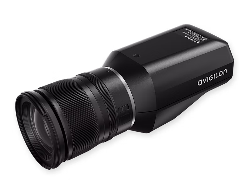 A high-resolution Avigilon H5 Pro box camera shown from a side profile angle, featuring a professional-grade black lens and sleek black housing with the Avigilon logo.