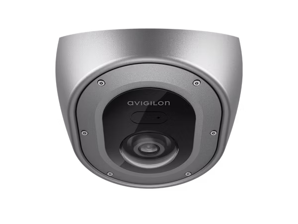 Front view of a stainless steel Avigilon H5A Corner Camera, featuring a wide-angle lens and a tamper-resistant, anti-ligature design for high-security environments.