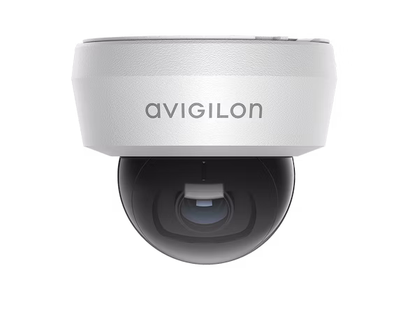 A front-facing shot of a white Avigilon H6 Mini Dome indoor security camera with a black spherical lens housing.