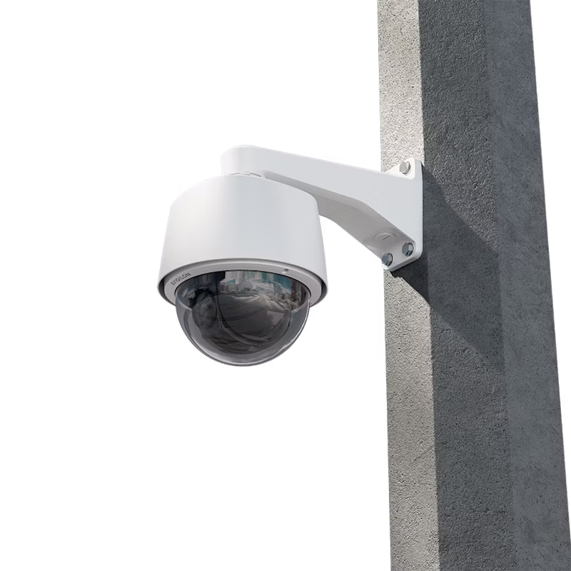 n Avigilon H6A PTZ dome security camera mounted to a concrete pillar with a white wall-arm bracket.