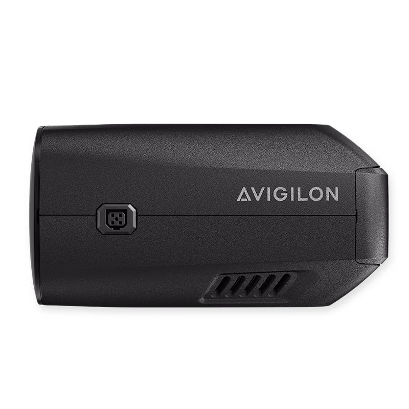 A side view of a matte black Avigilon H6X Box Camera showing the Avigilon logo and lens interface port.