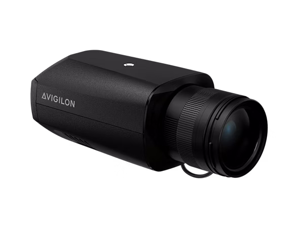 A sleek, matte black Avigilon H6X box camera equipped with a professional short focal length lens, shown from a front-side perspective against a white background.
