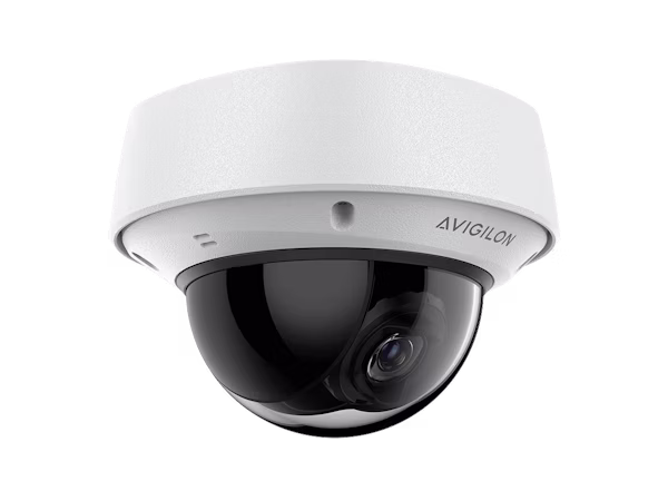 A white Avigilon H6A series indoor dome security camera with a black tinted protective bubble, shown from a low-angle front-right perspective against a white background.