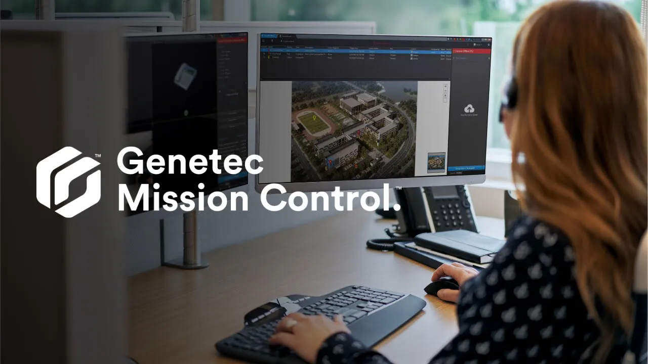 Security operator analysing a 3D facility map using Genetec Mission Control software on a dual-monitor workstation.