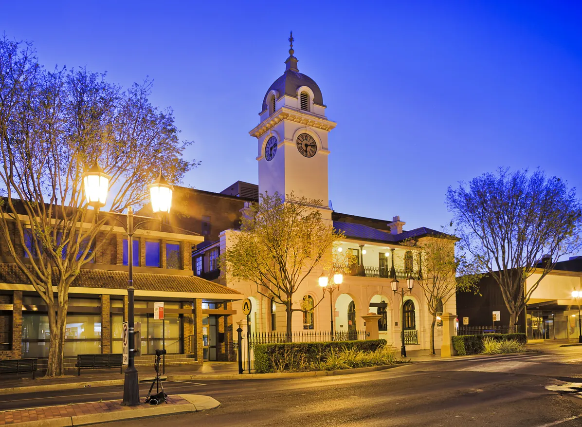 Clock tower and street lamps lit at dusk in Dubbo, a Western New South Wales town serviced by JD Security